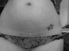 post-partum-stretch-marks-and-cesarean-scar-and-star-tattoo-460x344.jpg